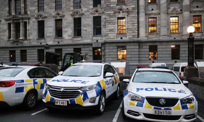 Police cars parked behind Parliament and Victoria University in Wellington, New Zealand, on March 2, 2022. (Lynn Grieveson/Getty Images)