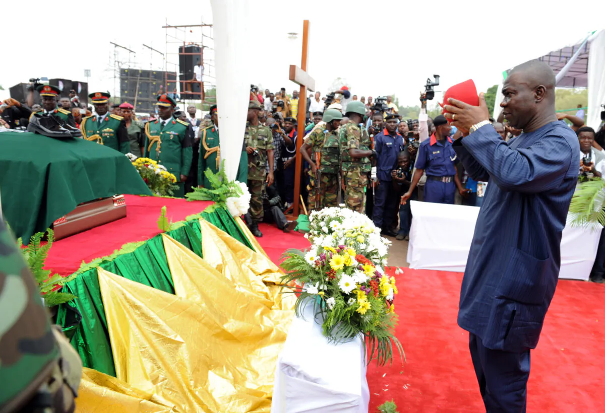 Ike Ekweremadu pays his respects to the Biafran secessionist leader Odumegwu Ojukwu during his funeral at Michael Opkara Square in Enugu, Nigeria, on March 1, 2012. (Pius Utomi Ekpei/AFP via Getty Images)