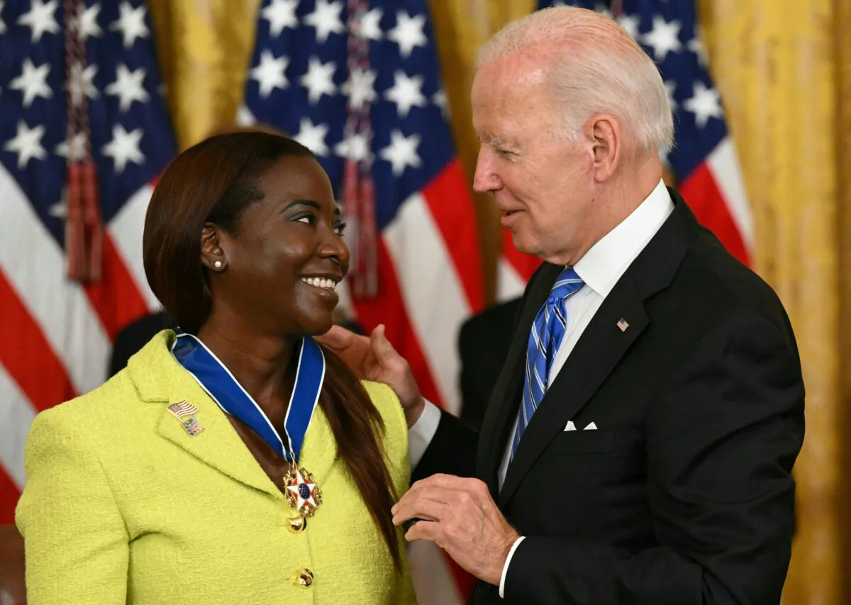 President Joe Biden presents Nurse Sandra Lindsay with the Presidential Medal of Freedom, the nation's highest civilian honor, during a ceremony in the East Room of the White House in Washington on July 7, 2022. (Saul Loeb/AFP via Getty Images)