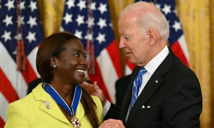 President Joe Biden presents Nurse Sandra Lindsay with the Presidential Medal of Freedom, the nation's highest civilian honor, during a ceremony in the East Room of the White House in Washington on July 7, 2022. (Saul Loeb/AFP via Getty Images)