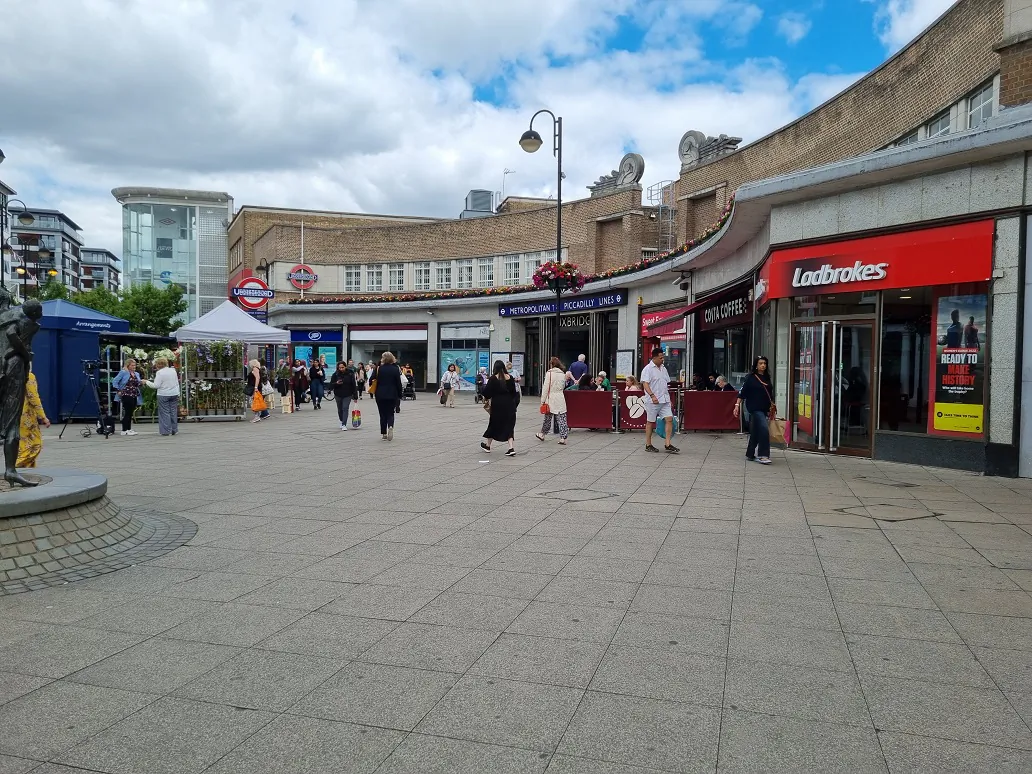 Shoppers walk through the centre of Uxbridge on July 7, 2022. (Chris Summers/The Epoch Times)
