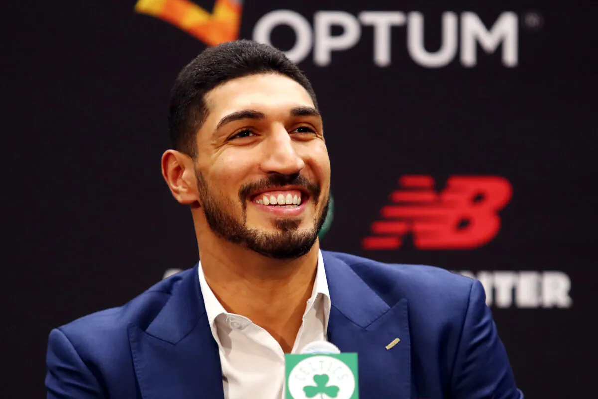 Enes Kanter reacts during a press conference as he is introduced as a member of the Boston Celtics at the Auerbach Center at New Balance World Headquarters in Boston, Mass., on July 17, 2019. (Tim Bradbury/Getty Images)