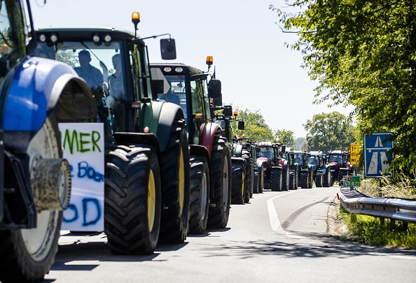 Tractors drive down the A1 highway between Apeldoorn and Stroe "No Farmer No Food"(Photo by SEM VAN DER WAL/ANP/AFP via Getty Images)