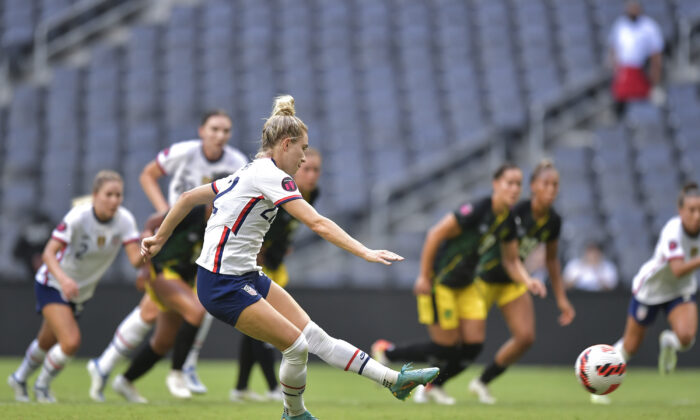 Kristie Mewis of USA kicks a penalty and scores her team's fourth goal during the match between Jamaica and United States as part of the 2022 Concacaf W Championship at BBVA Stadium, in Monterrey, Mexico, on July 07, 2022. (Azael Rodriguez/Getty Images)