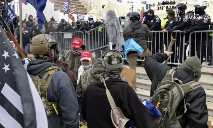 A self-described federal informant warned of Antifa and Black Lives Matter activists dressed as Trump supporters at the Capitol on Jan. 6, 2021. (Steve Baker/The Epoch Times)