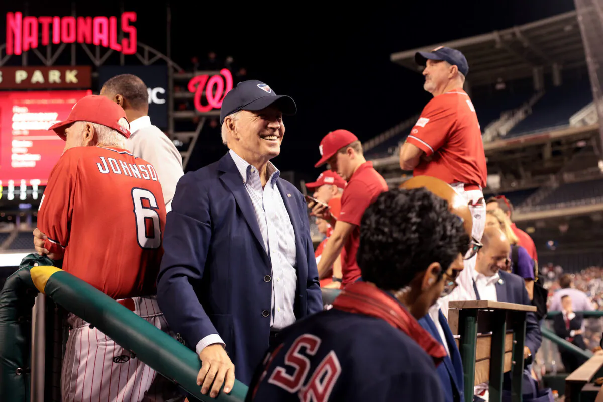 President Joe Biden visits the Republican dugout during the the Congressional baseball game at Nationals Park in Washington on Sept. 29, 2021. (Win McNamee/Getty Images)