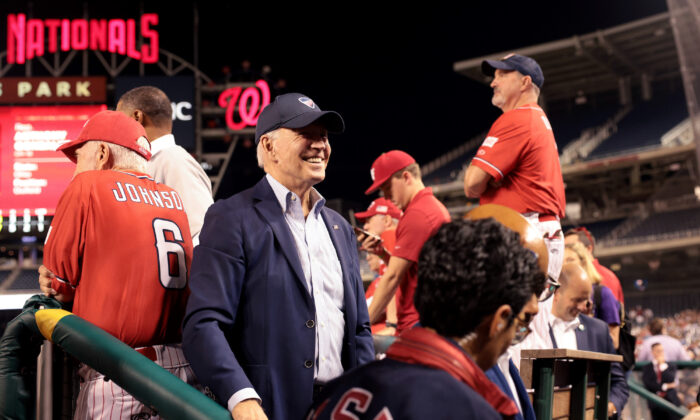 President Joe Biden visits the Republican dugout during the the Congressional baseball game at Nationals Park  in Washington on Sept. 29, 2021. (Win McNamee/Getty Images)