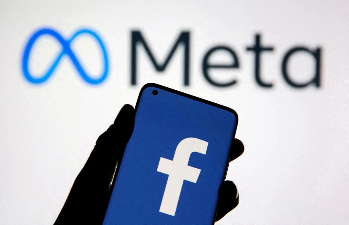 A smartphone with Facebook's logo is seen with new rebrand logo Meta in this illustration taken on Oct. 28, 2021. (Dado Ruvic/Reuters)