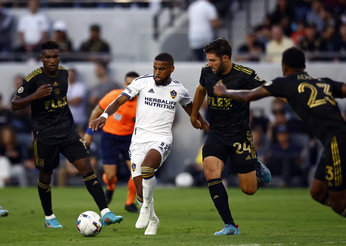 Samuel Grandsir #11 of Los Angeles Galaxy controls the ball against Ryan Hollingshead #24 of Los Angeles FC in the first half at Banc of California Stadium, in Los Angeles, on July 08, 2022. (Ronald Martinez/Getty Images)