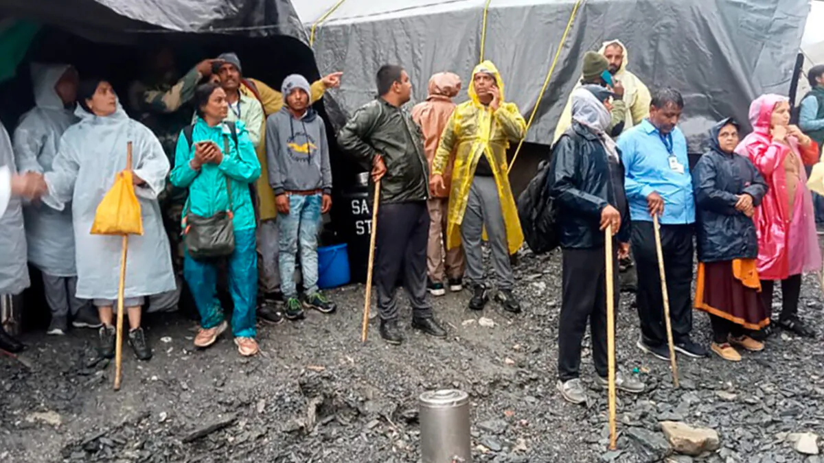 Hindu devotees are stranded after a cloudburst near the base camp of the cave shrine of Amarnath in south of Kashmir Himalayas, in India, on July 8, 2022. (Jammu and Kashmir Government's Department of Disaster Management via AP)