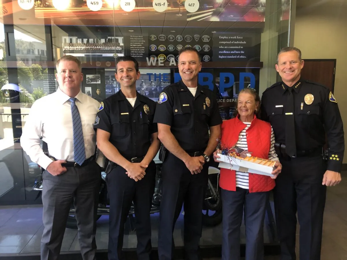 (L-R) Newport Beach Police Deputy Chief Joe Cartwright, Lt. Bryan Moore, Sgt. Jason Blakely, Dotty McDonald, Chief Jon Lewis in Newport Beach, Calif., on July 5, 2022. (Lynn Hackman/The Epoch Times)