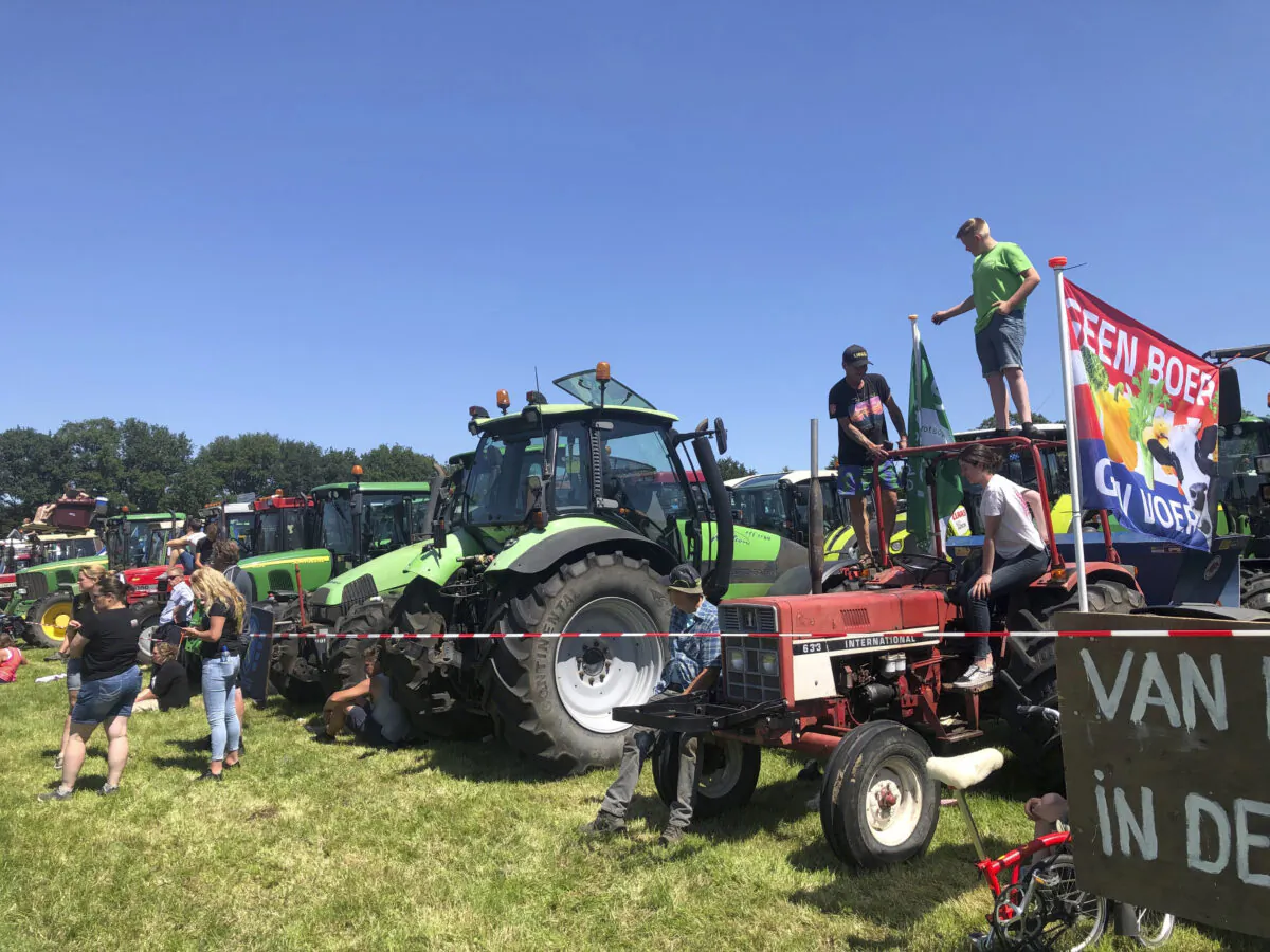 Dutch farmers protesting against the government’s plans to reduce emissions of nitrogen oxide and ammonia gather for a demonstration at Stroe, Netherlands, Wednesday, June 22, 2022. (AP Photo/Aleksandar Furtula)