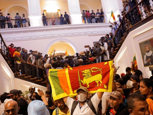 Demonstrators protest inside the President's House