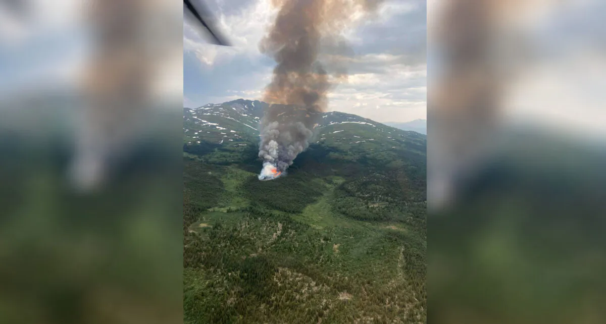 The Cap Mountain fire burning near Whitehorse is shown on Tuesday, July 5, 2022. Yukon is enveloped in smoke from wildfires, with the territory seeing a huge leap in the number of blazes this year. (The Canadian Press/HO-Government of Yukon)