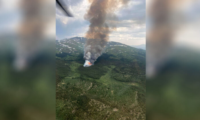 The Cap Mountain fire burning near Whitehorse is shown on Tuesday, July 5, 2022. Yukon is enveloped in smoke from wildfires, with the territory seeing a huge leap in the number of blazes this year. (The Canadian Press/HO-Government of Yukon)