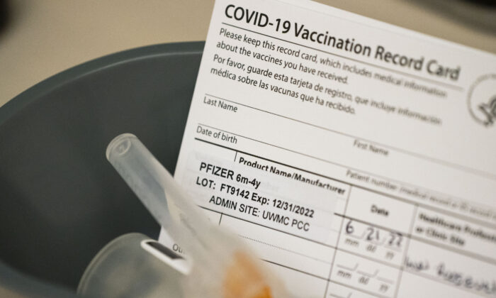 Doses of a COVID-19 vaccine and vaccination record cards for children under 5 in Seattle, Wash., in a June 21, 2022, file image. (David Ryder/Getty Images)