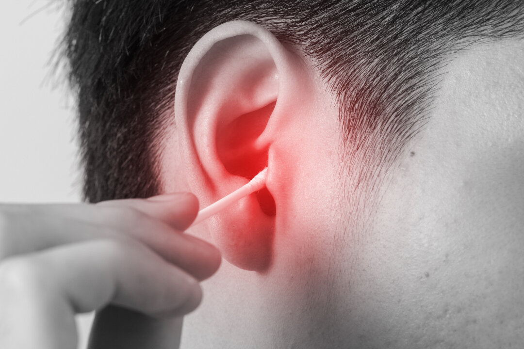 Cotton tipped applicators may remove some of the superficial wax, but often push the rest deeper into the ear canal. (By Onlyshaynestockphoto/shutterstock)