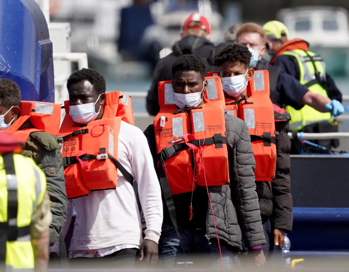 Migrants arrive in the UK in an undated file photo. (PA)