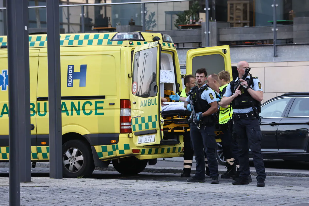 An ambulance and armed police outside the Field's shopping center, in Orestad, Copenhagen, Denmark, on July 3, 2022. (Olafur Steinar Gestsson /Ritzau Scanpix via AP)