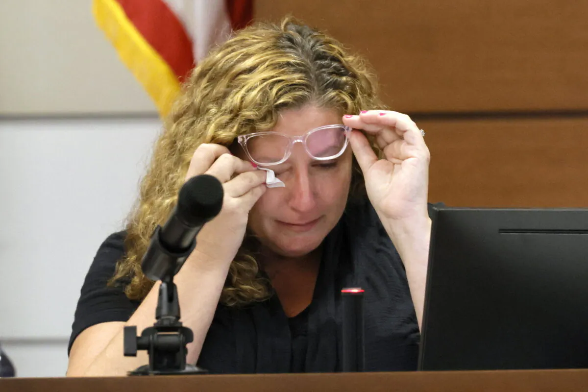 Marjory Stoneman Douglas High School teacher Dara Hass wipes away tears as she testifies in court about the shooting in her classroom during the penalty phase of Marjory Stoneman Douglas High School shooter Nikolas Cruz's trial at the Broward County Courthouse in Fort Lauderdale, Fla., on July 19, 2022. (Mike Stocker/South Florida Sun Sentinel via AP, Pool)