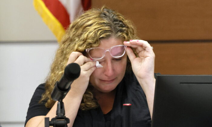 Marjory Stoneman Douglas High School teacher Dara Hass wipes away tears as she testifies in court about the shooting in her classroom during the penalty phase of Marjory Stoneman Douglas High School shooter Nikolas Cruz's trial at the Broward County Courthouse in Fort Lauderdale, Fla., on July 19, 2022. (Mike Stocker/South Florida Sun Sentinel via AP, Pool)