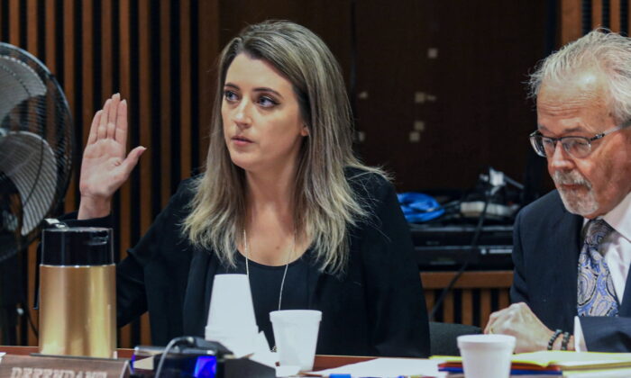 Kate McClure, 32, charged with theft by deception in the $400,00 GoFundMe scam, with her lawyer Jim Gerrow Jr., in State Superior Court, Burlington County Courthouse in Mt. Holly, N.J., on April 15, 2019. (David Swanson/The Philadelphia Inquirer via AP)