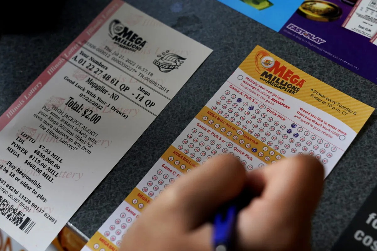 A customer fills out a Mega Millions lottery ticket at a convenience store in Northbrook, Ill., on July 21, 2022. (Nam Y. Huh/AP Photo)