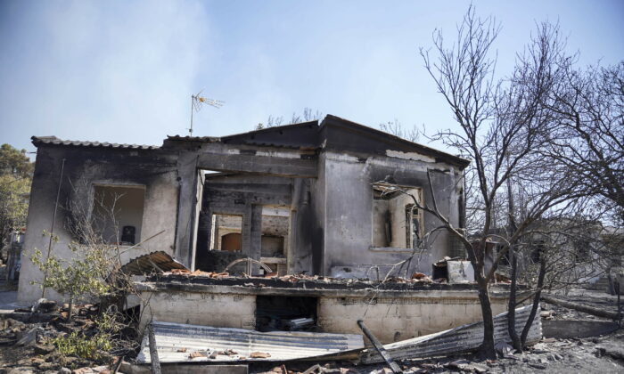 A burnt house following a forest fire near the beach resort of Vatera, on the eastern Aegean island of Lesbos, on July 24, 2022. (Panagiotis Balaskas/AP Photo)
