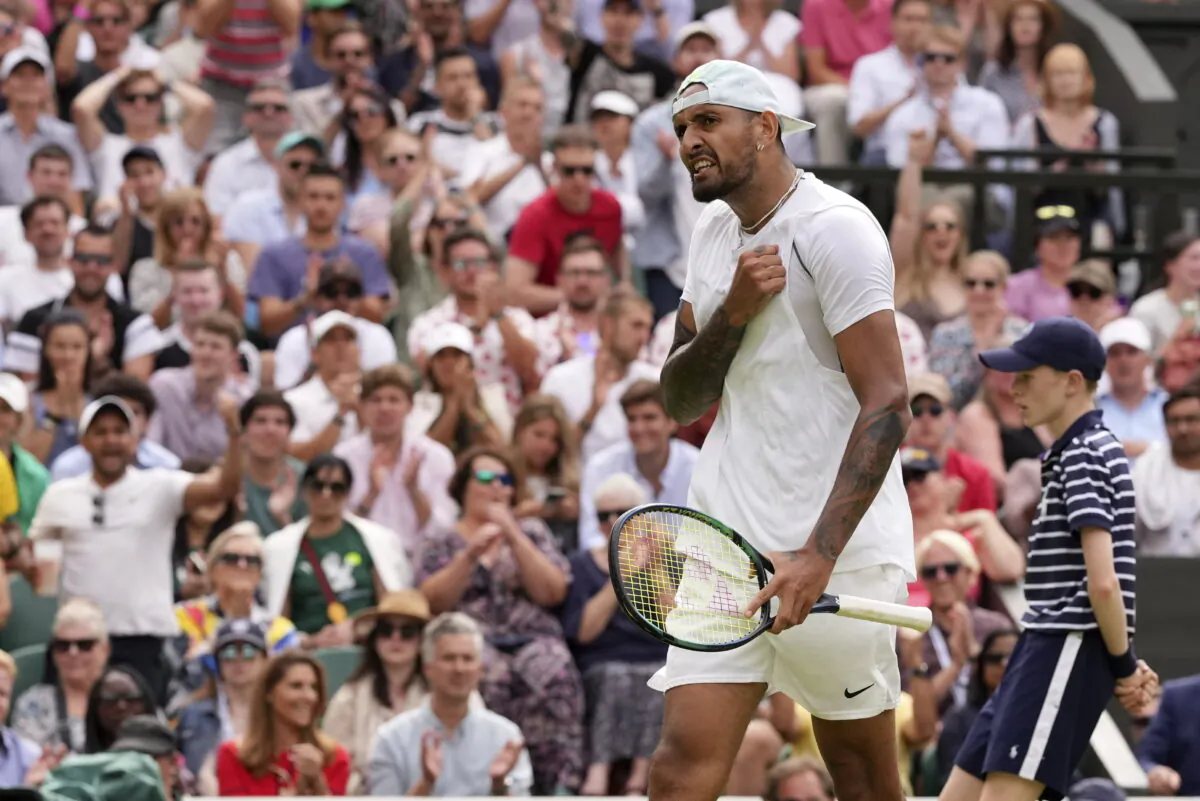 Australia's Nick Kyrgios reacts after winning a point against Brandon Nakashima of the United States in a men's singles fourth round match on day eight of the Wimbledon tennis championships in London on July 4, 2022. (Alberto Pezzali/AP Photo)