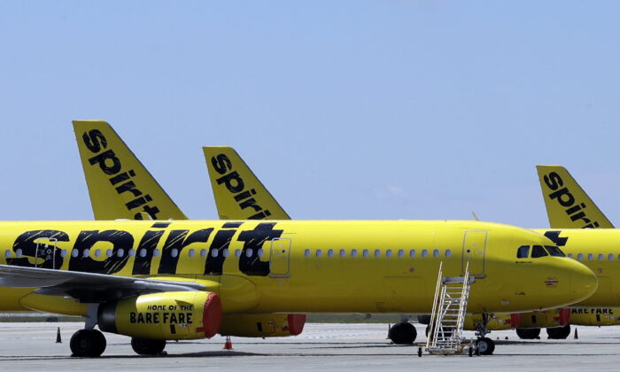 A line of Spirit Airlines jets sit on the tarmac at Orlando International Airport, in Orlando, Fla., on May 20, 2020. (Chris O'Meara/AP Photo)