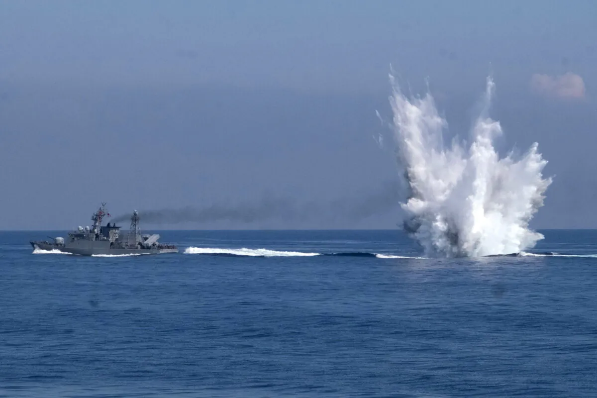 A Ching Chiang class patrol ship fires off depth charges underwater as part of a navy demonstration in Taiwan's annual Han Kuang exercises off the island's eastern coast near the city of Yilan, Taiwan, on July 26, 2022. (Huizhong Wu, File/AP Photo)