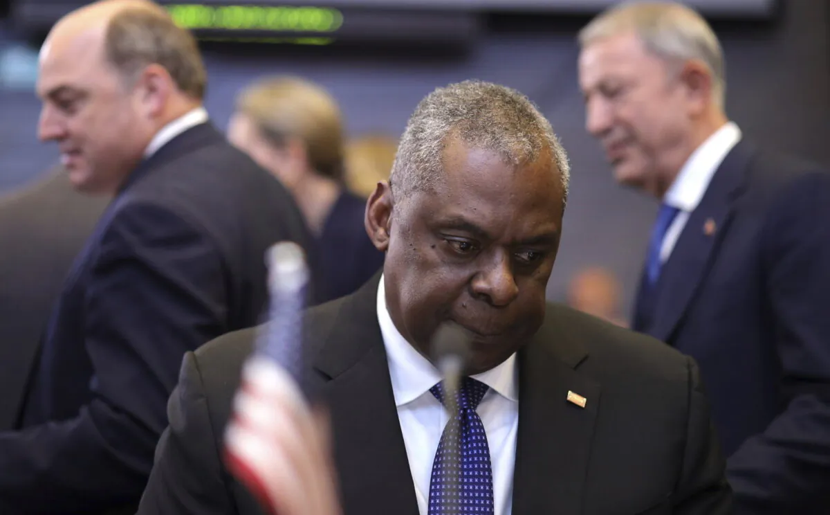 U.S. Secretary of Defense Lloyd J. Austin III, center, waits for the start of a meeting of NATO defense ministers at NATO headquarters in Brussels on June 16, 2022. (Olivier Matthys/AP Photo)