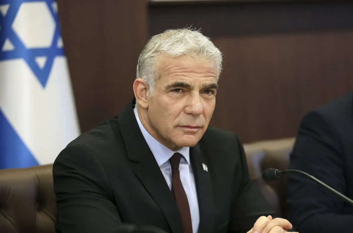 Israel's caretaker Prime Minister Yair Lapid chairs the first cabinet meeting in Jerusalem on July 3, 2022, days after lawmakers dissolved parliament. (Gil Cohen-Magen/Pool Photo via AP)