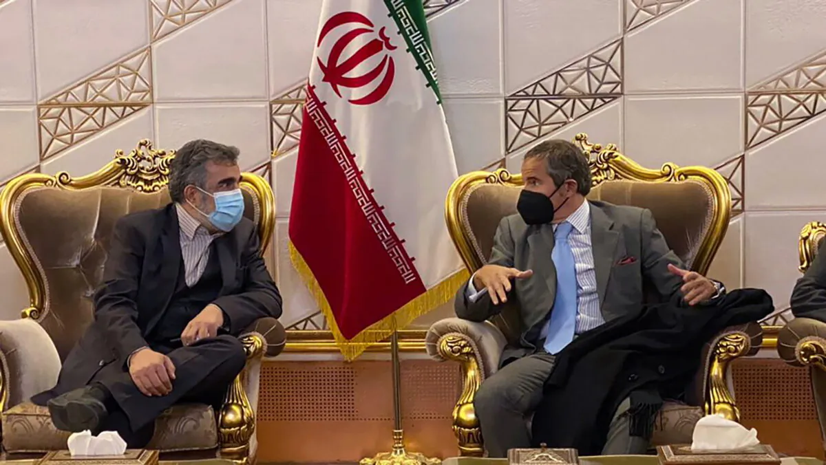 Director General of International Atomic Energy Agency (IAEA) Rafael Mariano Grossi (R) speaks with deputy head of the Atomic Energy Organization of Iran Behrouz Kamalvandi at Imam Khomeini Airport, in Tehran, Iran, on Nov. 22, 2021. (Atomic Energy Organization of Iran via AP)