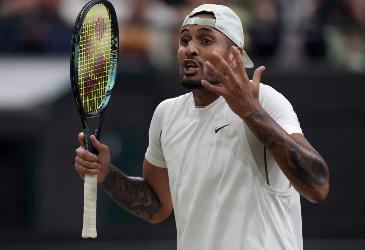Australia's Nick Kyrgios reacts during his third round men's singles match against Greece's Stefanos Tsitsipas on day six of the Wimbledon tennis championships in London, on July 2, 2022. (Kirsty Wigglesworth/AP Photo)