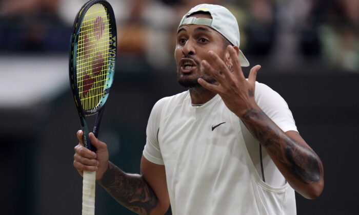 Australia's Nick Kyrgios reacts during his third round men's singles match against Greece's Stefanos Tsitsipas on day six of the Wimbledon tennis championships in London, on July 2, 2022. (Kirsty Wigglesworth/AP Photo)
