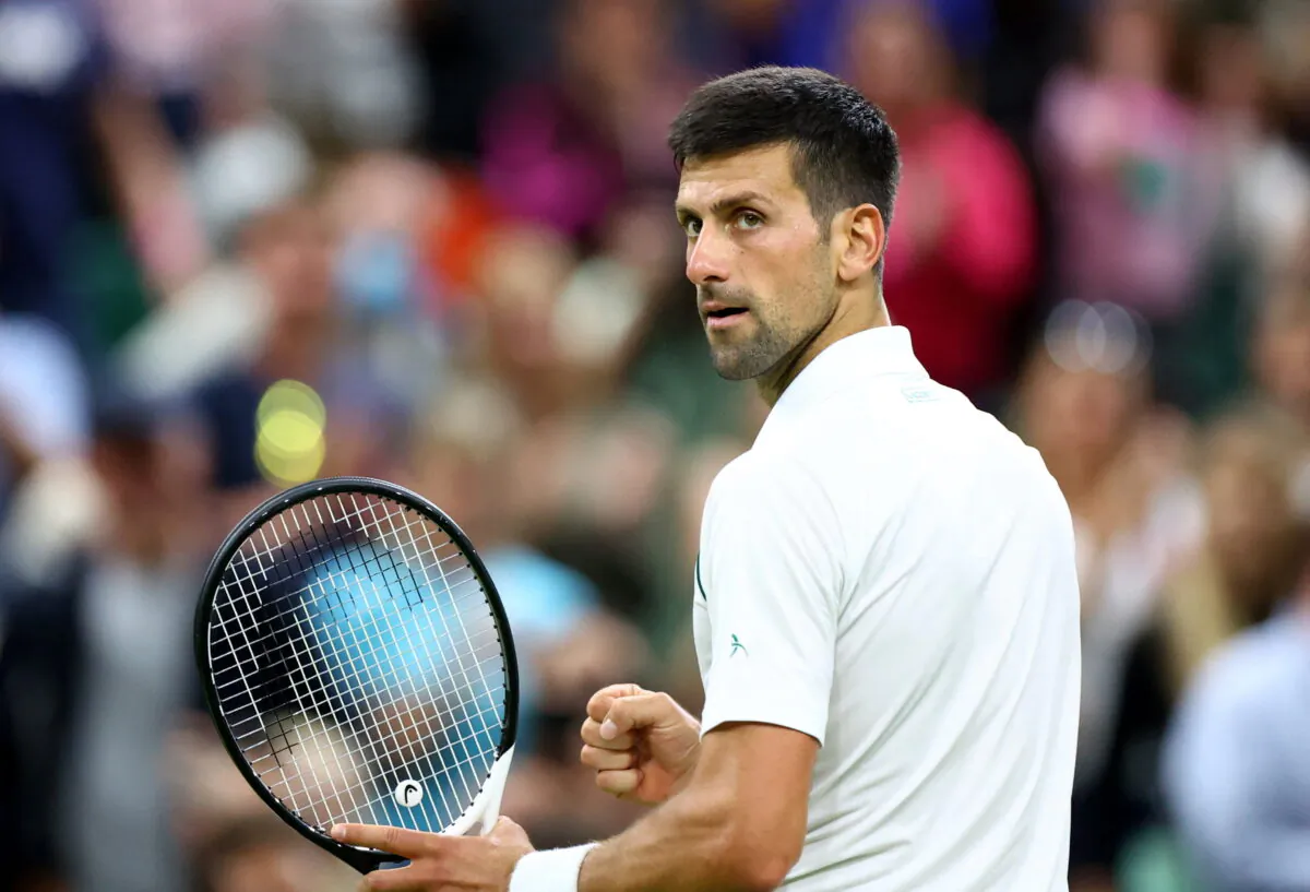 Serbia's Novak Djokovic celebrates after winning his fourth round match against Netherlands' Tim van Rijthoven in All England Lawn Tennis and Croquet Club, Wimbledon, London on July 3, 2022. (Hannah Mckay/Reuters)
