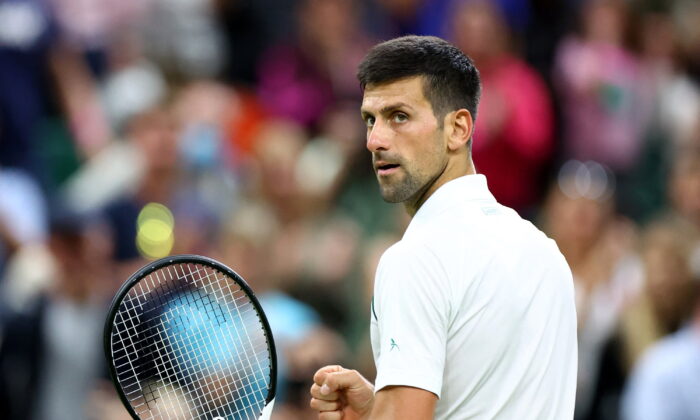 Serbia's Novak Djokovic celebrates after winning his fourth round match against Netherlands' Tim van Rijthoven in All England Lawn Tennis and Croquet Club, Wimbledon, London on July 3, 2022. (Hannah Mckay/Reuters)