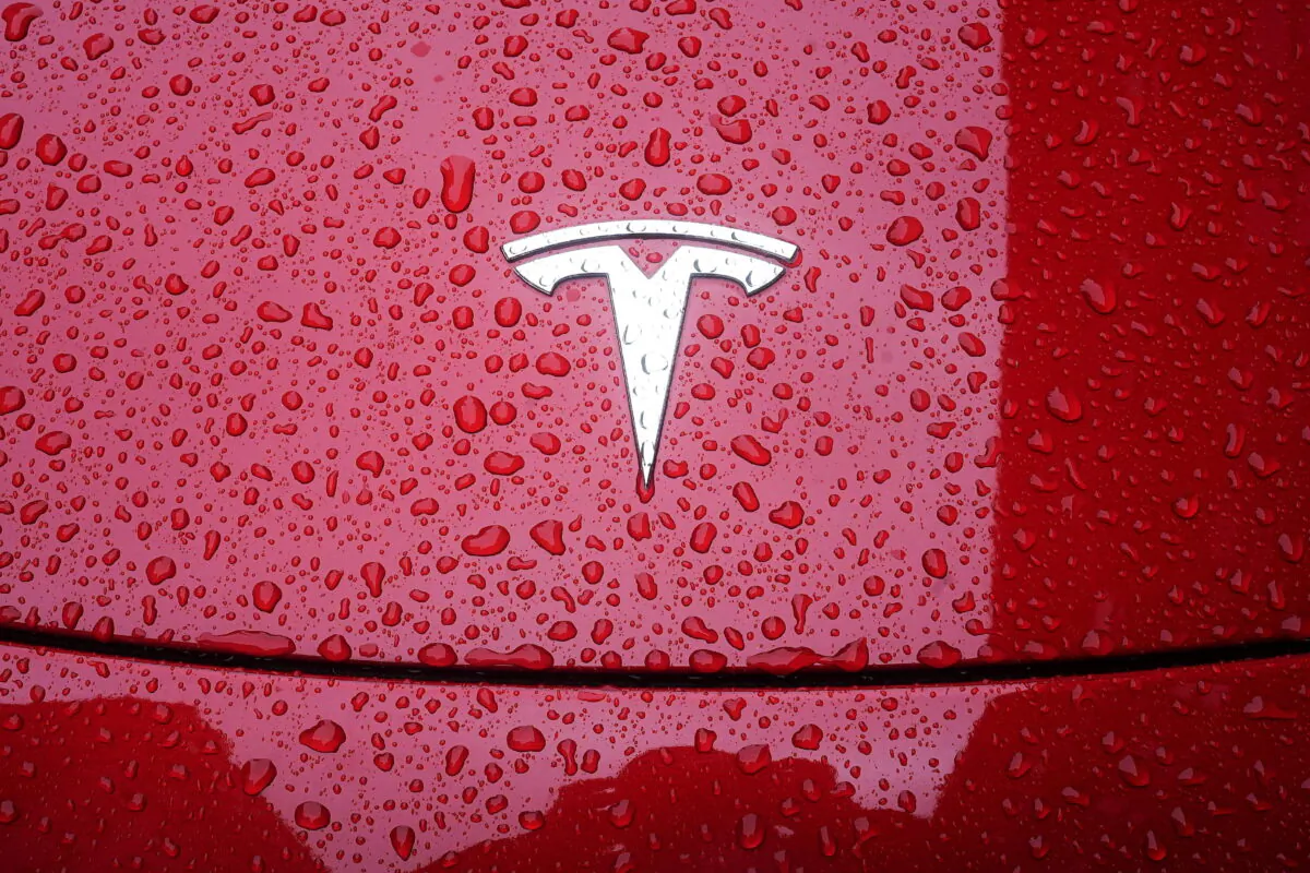 A Tesla logo on a car in the rain in the Manhattan borough of New York on May 5, 2021. (Carlo Allegri/Reuters)