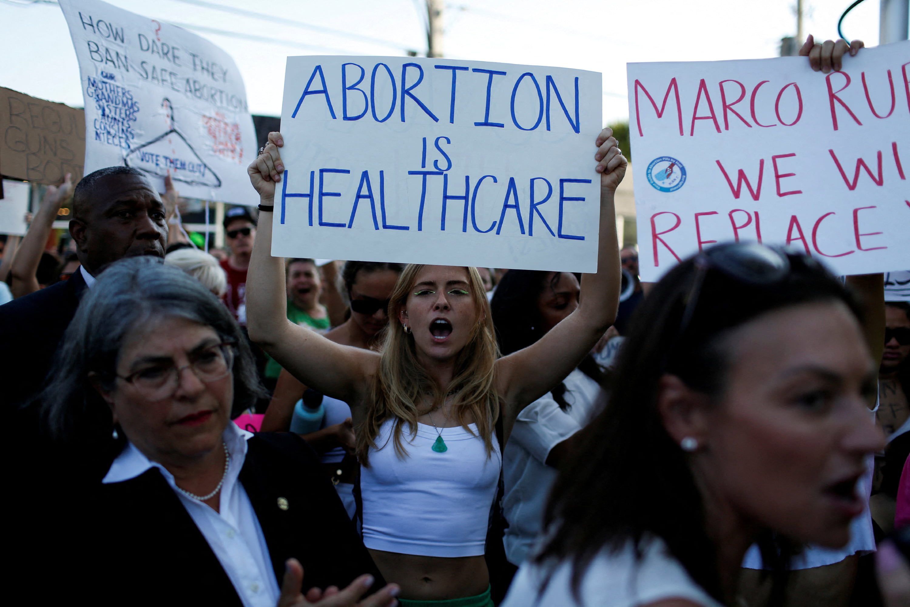 An abortion rights protester holds a sign as she demonstrates on June 24, 2022. (REUTERS/Marco Bello)