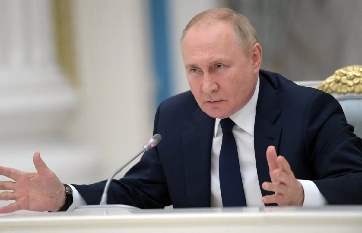 Russian President Vladimir Putin attends a meeting with parliamentary leaders in Moscow, on July 7, 2022. (Aleksey Nikolskyi/Sputnik/Kremlin via Reuters)