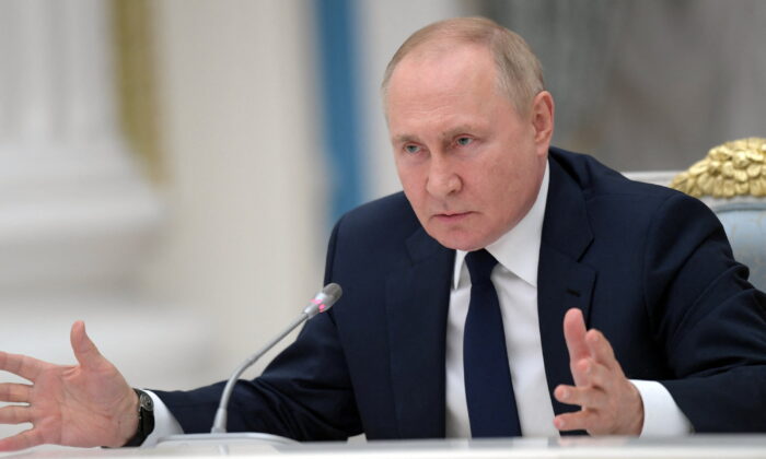 Russian President Vladimir Putin attends a meeting with parliamentary leaders in Moscow, on July 7, 2022. (Aleksey Nikolskyi/Sputnik/Kremlin via Reuters)