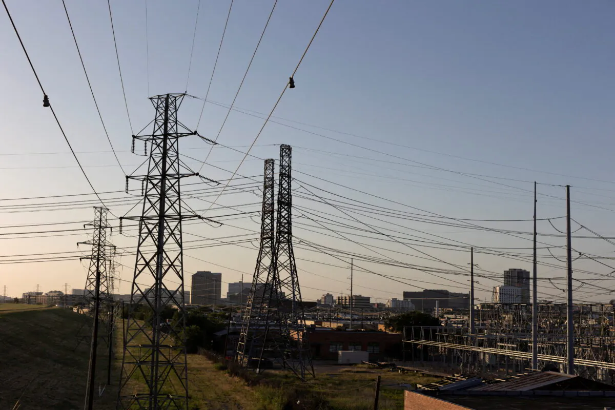 Power lines are seen during a heatwave with expected temperatures of 102 F (39 C) in Dallas, Texas, U.S. June 12, 2022. Though the heat wave caused electricity use in Texas to reach an all time high, the power grid remained largely stable without major issues. (REUTERS/Shelby Tauber)