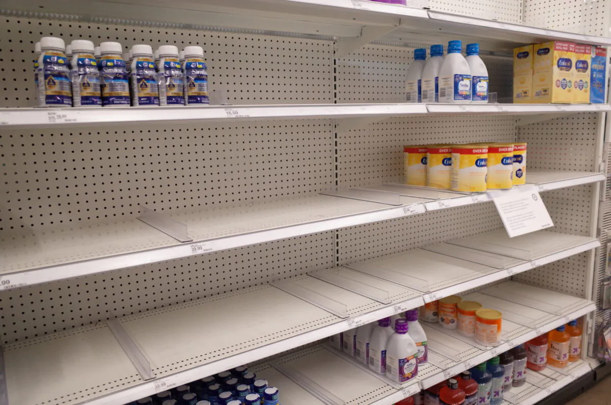 Similac and Enfamil products on largely empty shelves in the baby formula section of a Target store in San Diego on May 25, 2022. (Bing Guan/Reuters)