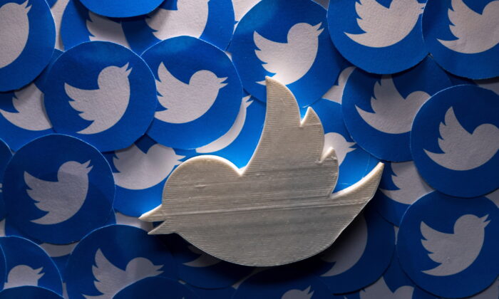 A 3D-printed Twitter logo on non-3D printed Twitter logos is seen in this picture illustration taken on April 28, 2022. (Dado Ruvic/Reuters)