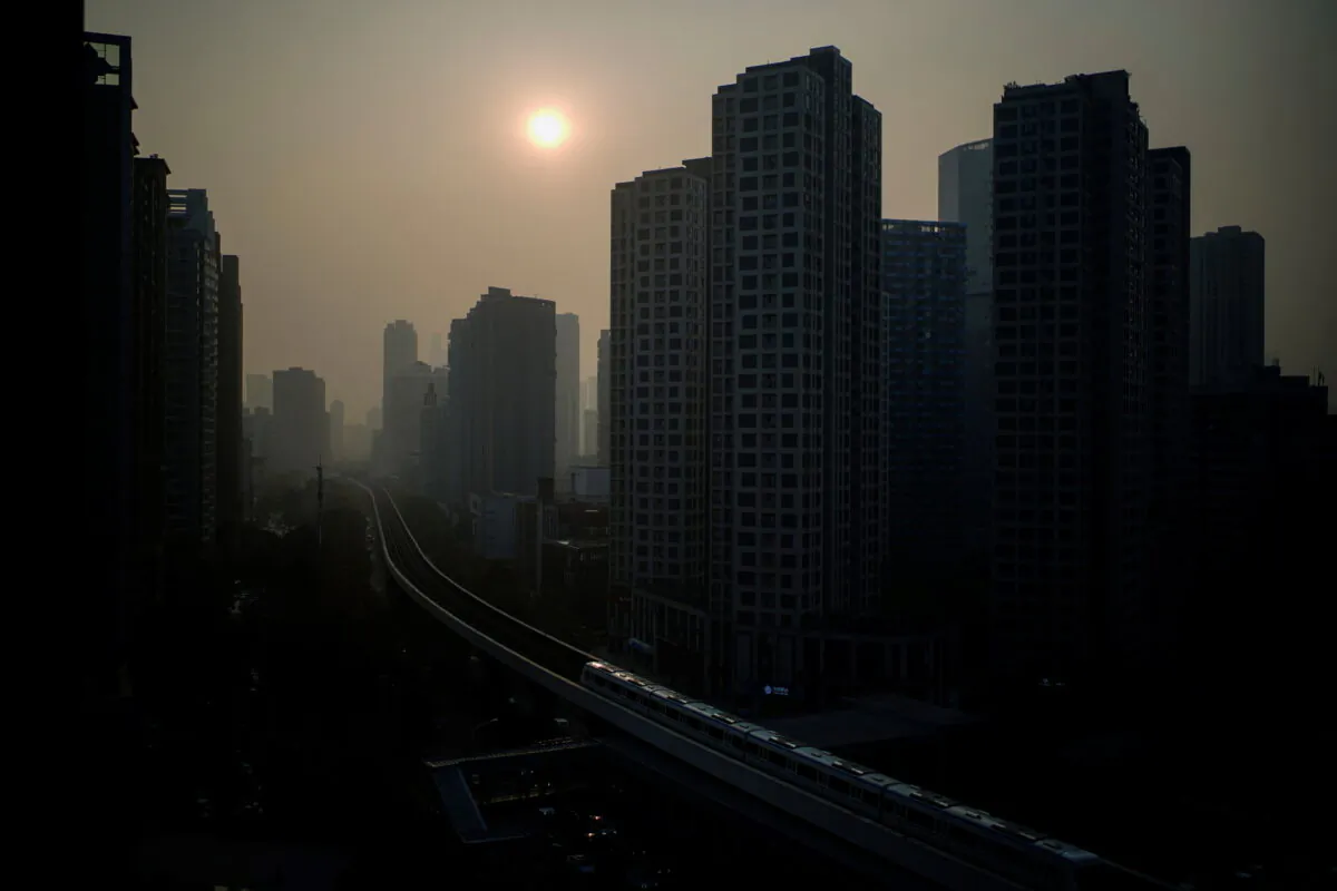 Buildings are seen at sunset, almost a year after the global outbreak of COVID-19 in Wuhan, Hubei province, China, on Dec. 12, 2020. (Aly Song/Reuters)