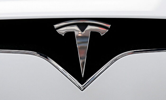 The Tesla logo on a car at Tesla Motors' new showroom in Manhattan's Meatpacking District in New York on Dec. 14, 2017. (Brendan McDermid/Reuters)