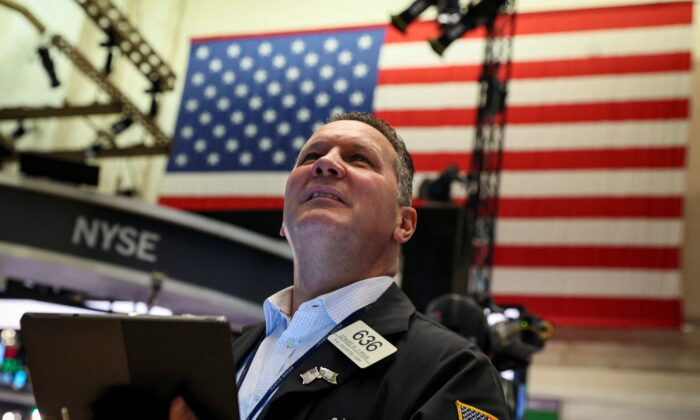 A trader works on the floor of the New York Stock Exchange (NYSE) in New York City on July 13, 2022. (Brendan McDermid/Reuters)