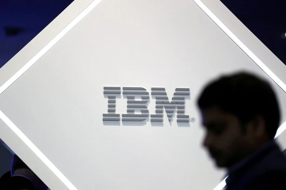 A man stands near an IBM logo at the Mobile World Congress in Barcelona, Spain on Feb. 25, 2019. (Sergio Perez/Reuters)
