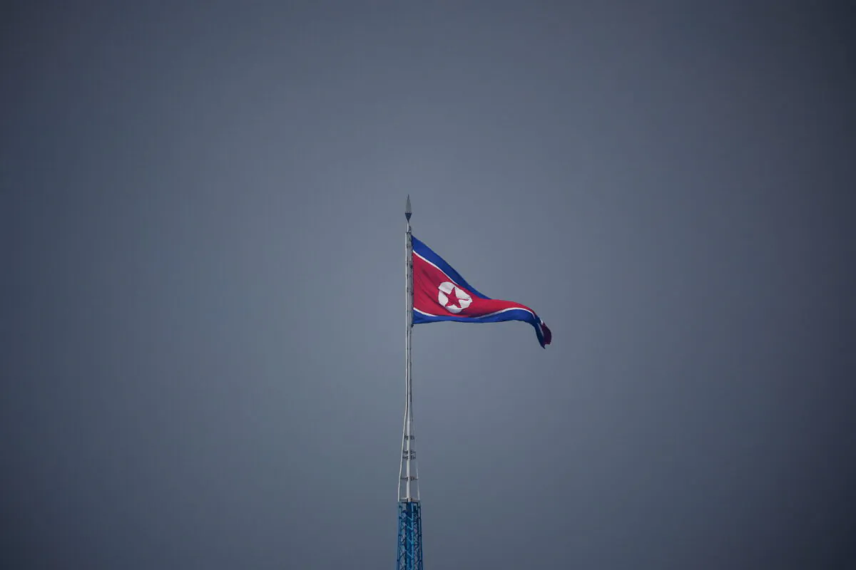 A North Korean flag flutters at the propaganda village of Gijungdong in North Korea, in this picture taken near the truce village of Panmunjom inside the demilitarized zone (DMZ) separating the two Koreas, in South Korea on July 19, 2022.  (Kim Hong-Ji/Pool/Reuters)